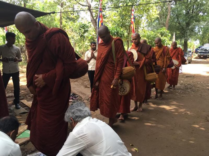 Offering alms to the monks