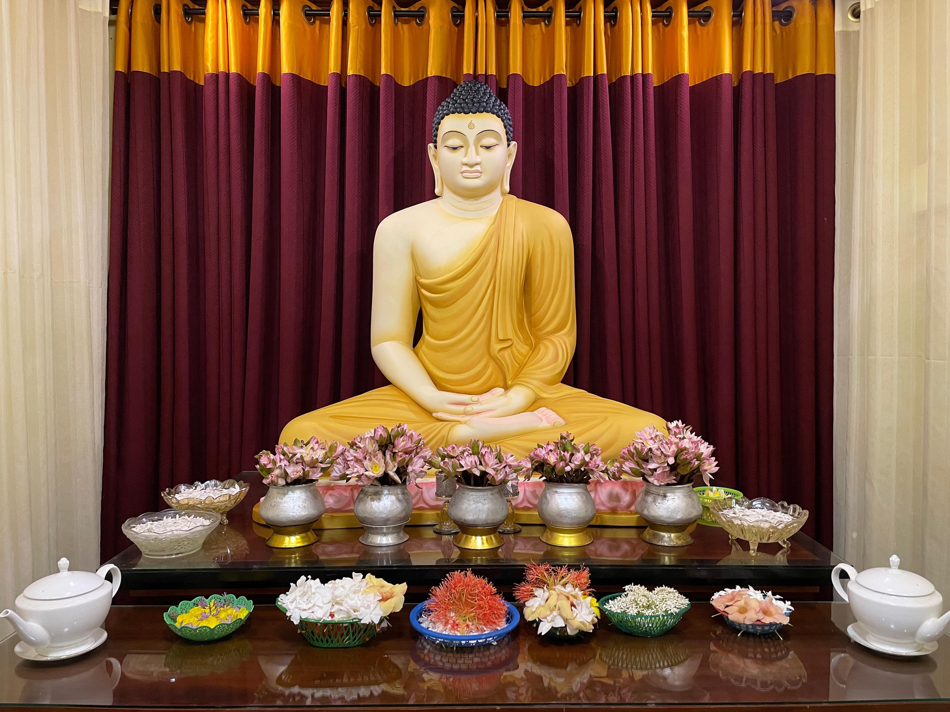 Dharma Pradeepa Buddha Statue with Offerings